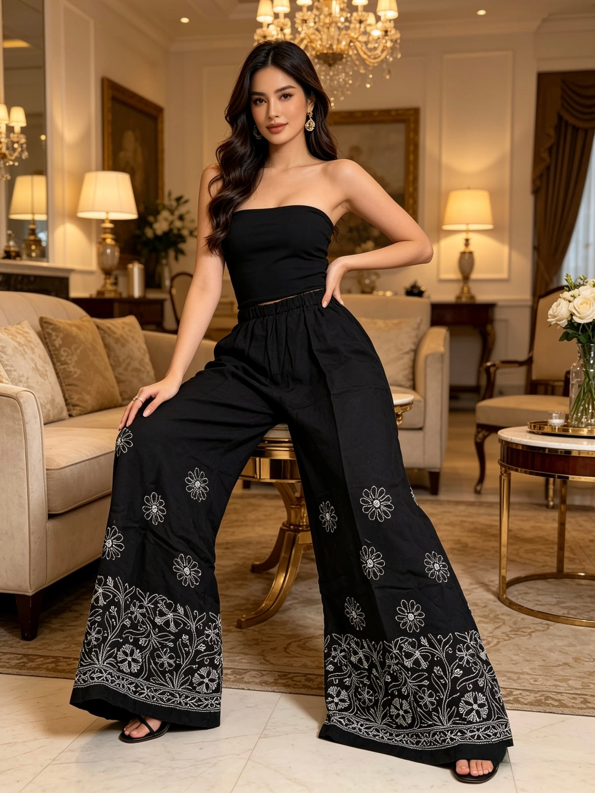Jet black cotton flared pants with white Chikankari paisley embroidery front view