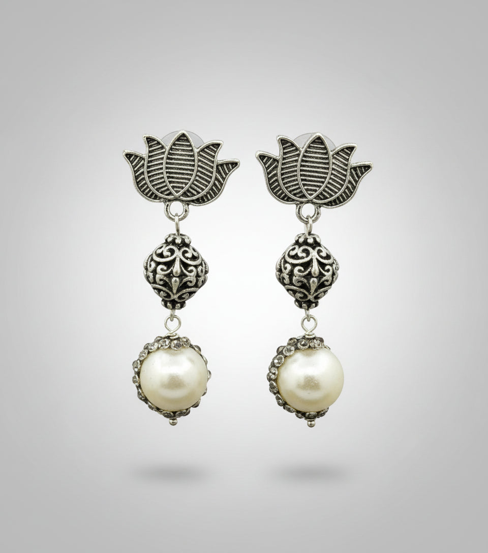 Lotus design earrings with silver and pearl beads in drop. Oxidised earrings.