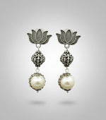 Lotus design earrings with silver and pearl beads in drop. Oxidised earrings.