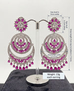 A pair of Luxe Fuchsia Crescent Chandbali Statement Dangle Earrings displayed on a stand, showcasing detailed dimension measurements and vibrant pink stone craftsmanship.