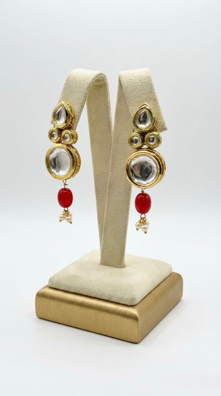Matching earrings of the regal Kundan bridal set displayed on a stand.