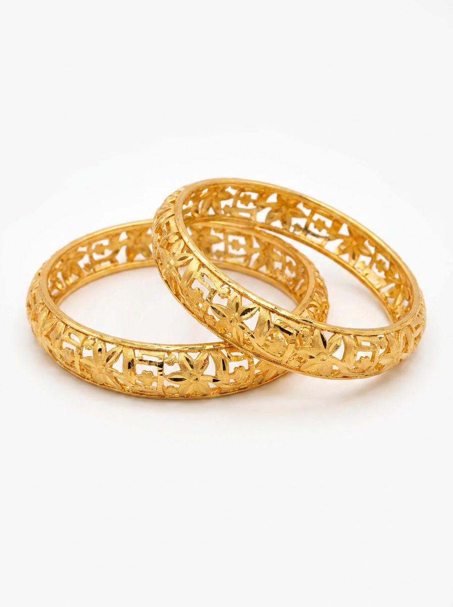 A pair of micro-gold plated copper bangles featuring an intricate floral lattice cutwork design, shown against a clean white background.