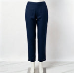 Mannequin display focusing on the matching navy blue trousers of the co-ord set, featuring detailed trim embroidery at the hems against a white marble floor.