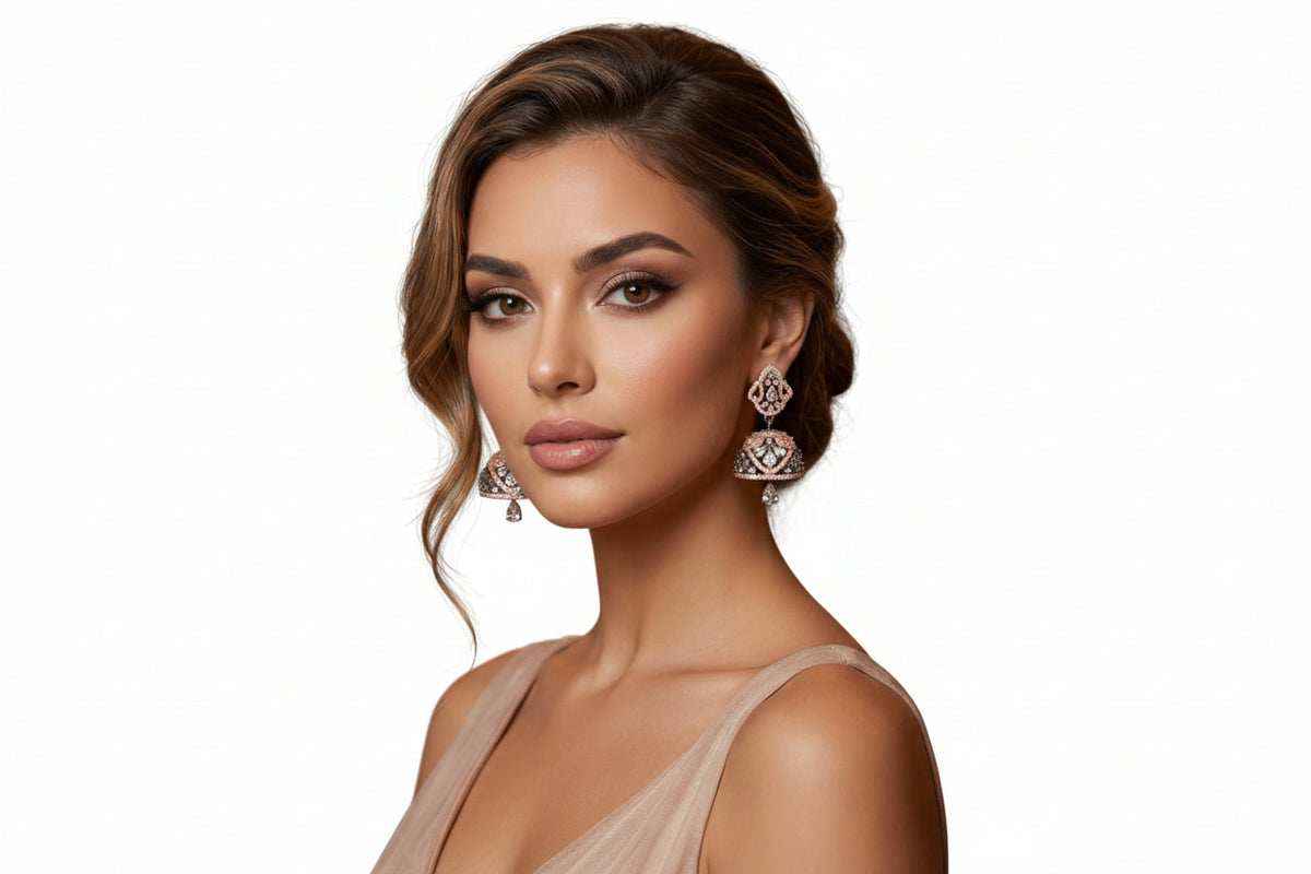 Model is displaying the rose gold small jhumka with back and rose gold stones.