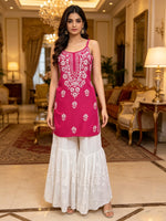 Model is showcasing the noodle hot pink short top with hand embroidered kurti.
