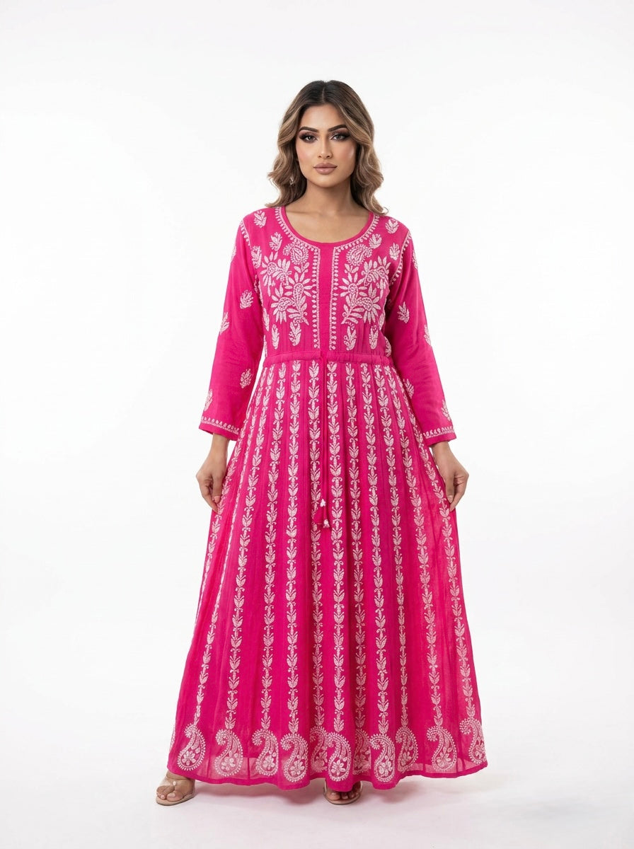Model is showing the front view of this Hot Pink chikankari hand embroidered Aanarkali long dress.
