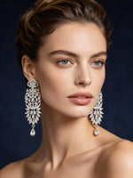 Model is wearing American Diamond earrings .