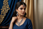 Model is wearing American Diamond necklace , earrings and maag tikka with navy blue centre stones with white cubic zirconia.