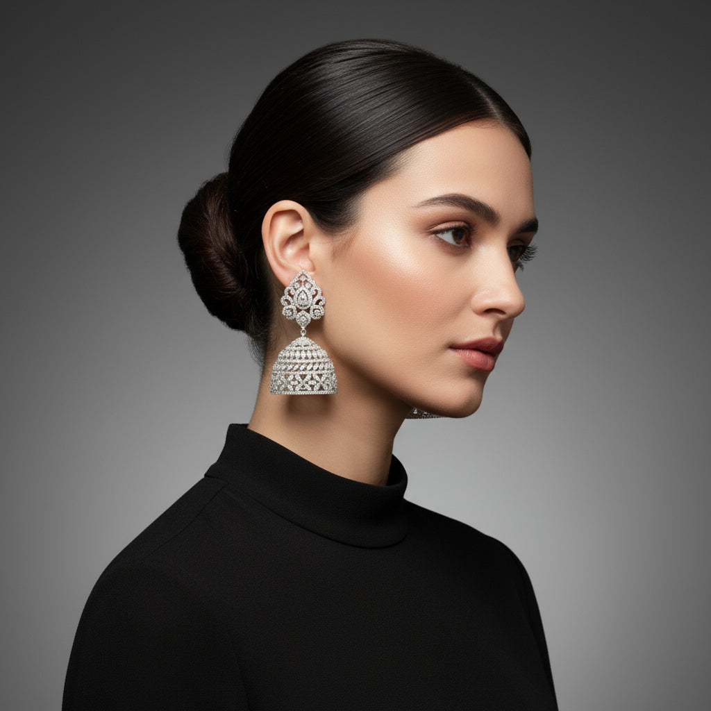 Model is wearing American diamonds jhumka earrings. Party wear earrings.