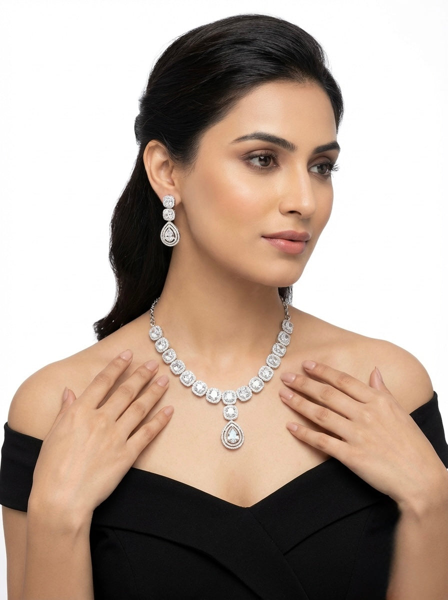 Model is wearing American diamonds necklace and earrings jewellery set.