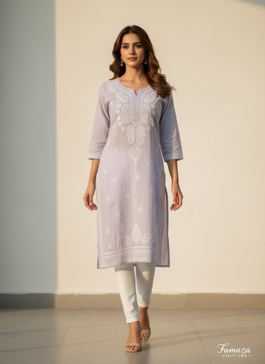 Model is wearing and posing in this grey colour cotton kurta front side design with white hand embroidery and wearing white jeans by famaza couture