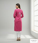 Model is wearing and posing in this hot pink colour cotton kurta back side design with white hand embroidery and wearing white jeans by famaza couture