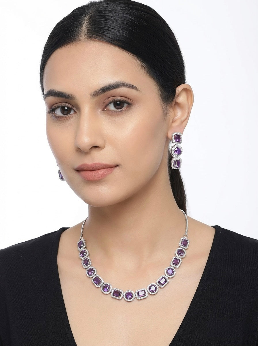 Model is wearing purple gemstones with silver plating choker necklace and matching dangling earrings