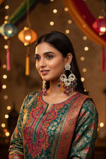 Model wearing silver coated brass Kundan earrings with multi-colored beads for a posh party wear look.