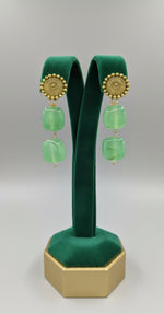 Mona lisa apple green stone with golden studs.