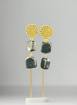 Mona lisa black stone with golden studs.