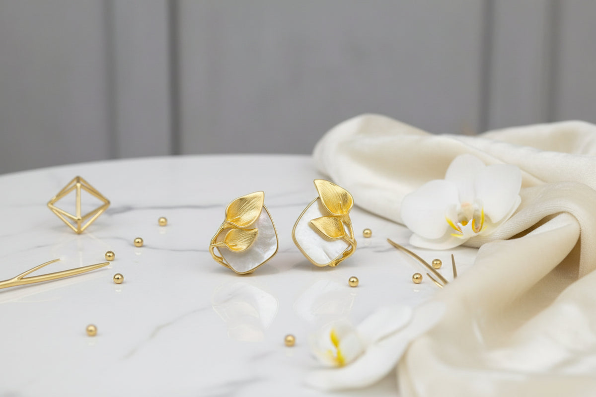 The Gold plated mother of pearl petal flower stud earrings by Famaza Couture