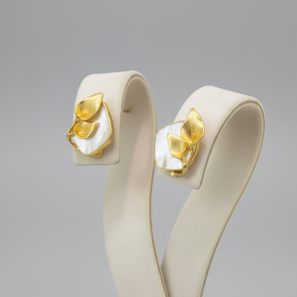 A Gold plated mother of pearl petal flower stud earrings by Famaza Couture