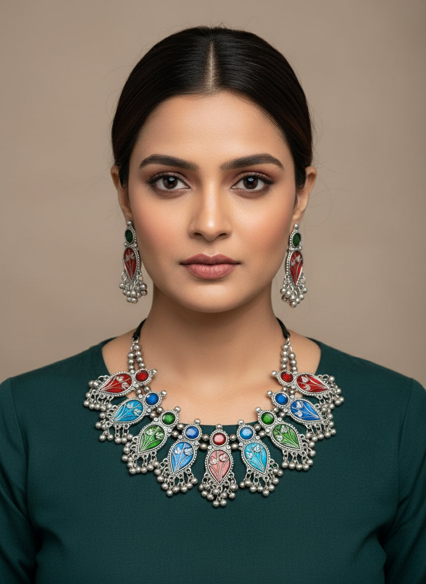 Multicolour oxidised silver necklace and earrings set with red, blue, and green enamel design – handcrafted Indian jewellery by Famaza Couture