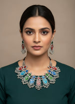 Multicolour oxidised silver necklace and earrings set with red, blue, and green enamel design – handcrafted Indian jewellery by Famaza Couture