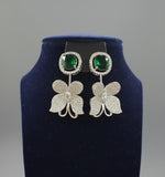 Nano American diamonds and emerald green central stone earrings by famaza couture