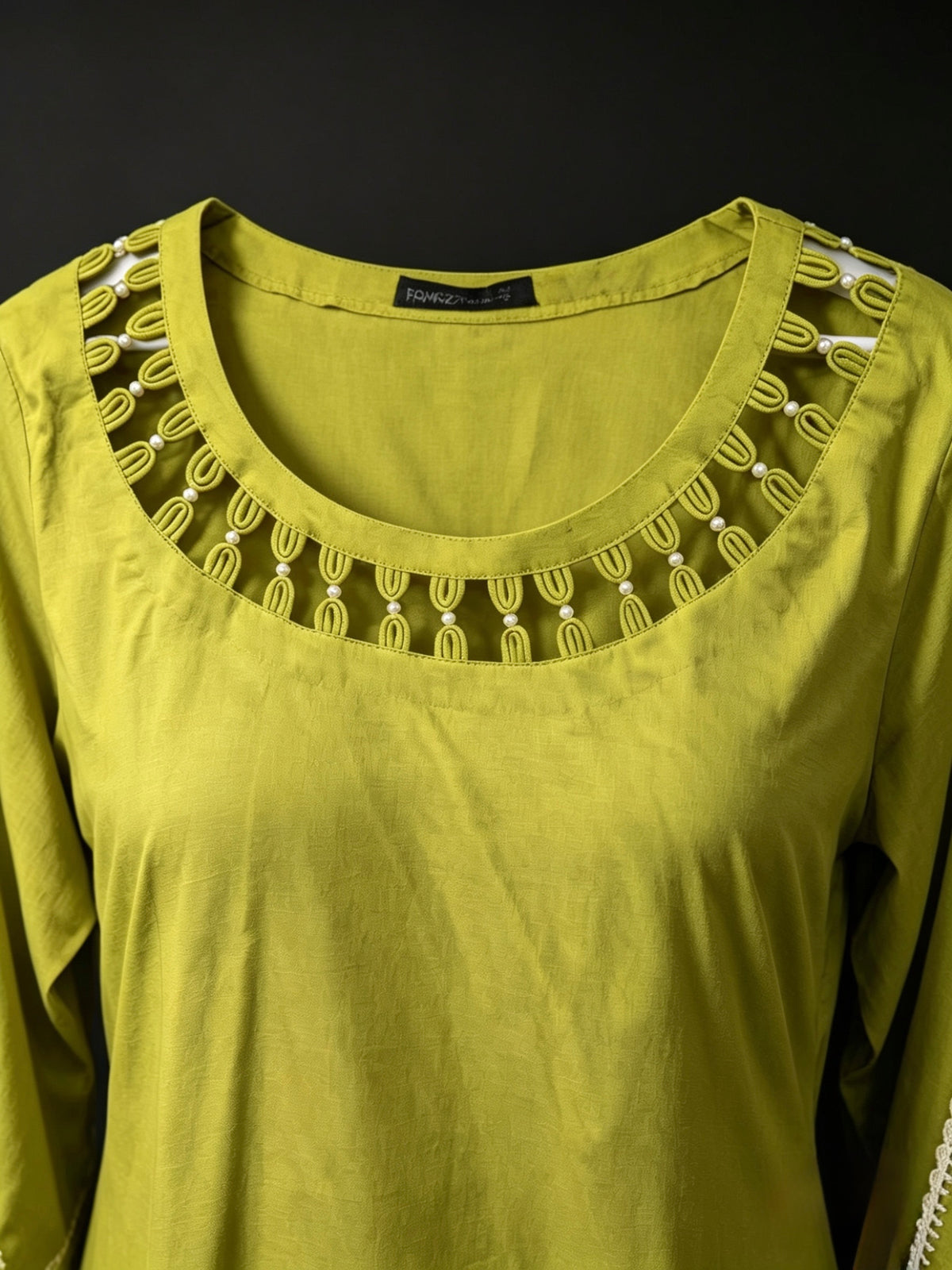 Olive green top neck design is focused.