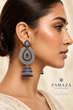 oxidised tone tear drop earrings with blue nano stones and hanging are wornby mode