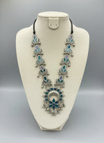 Oxidised long necklace with teal and purple paint on the leaf designs