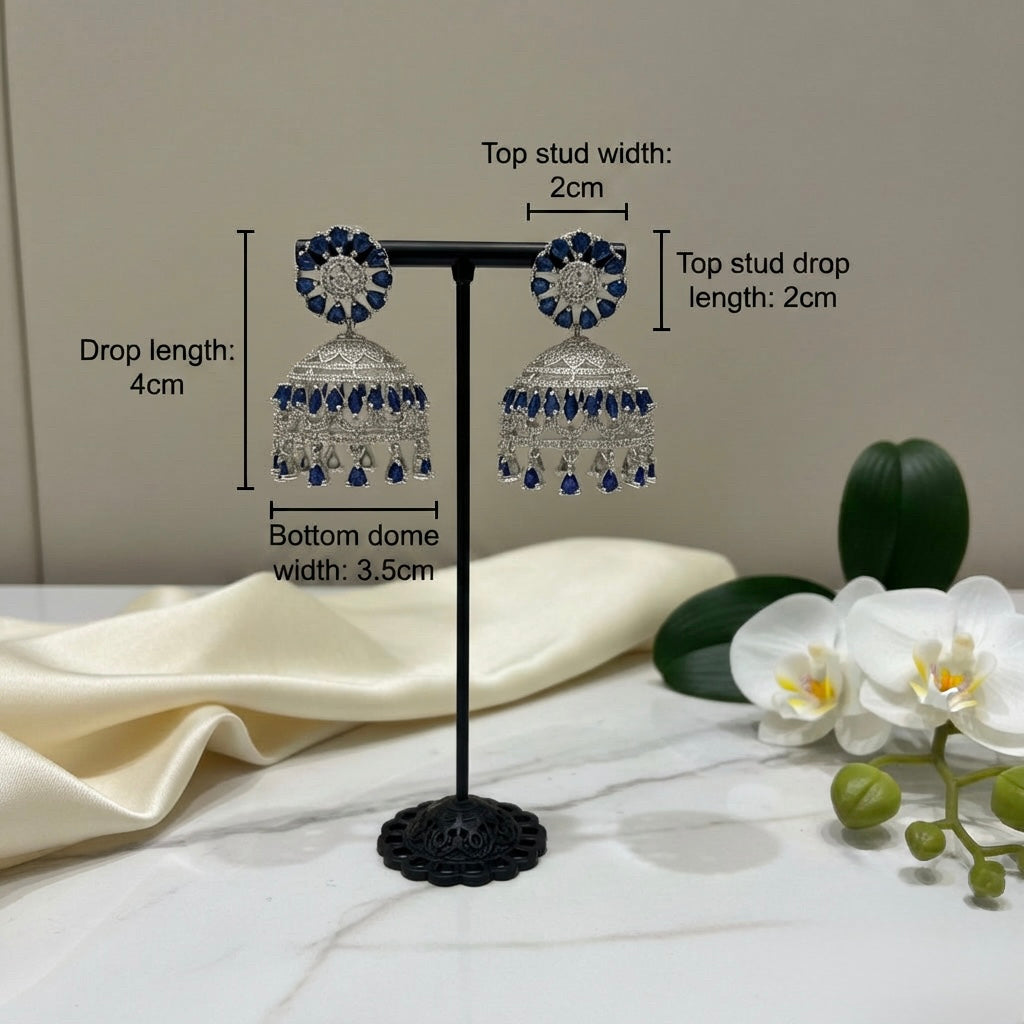 Pair of American diamond earrings with navy blue stone on a stand with measurements indicated.