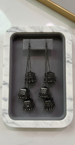 Pair of black polish chandelier earrings by famaza couture