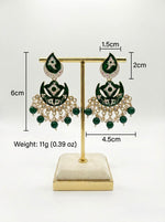 Pair of green and gold earrings on a gold stand with measurements and weight displayed.