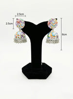 Pair of hand-painted white enamel jhumka earrings with a butterfly motif and dangling metallic beads. with easurments.