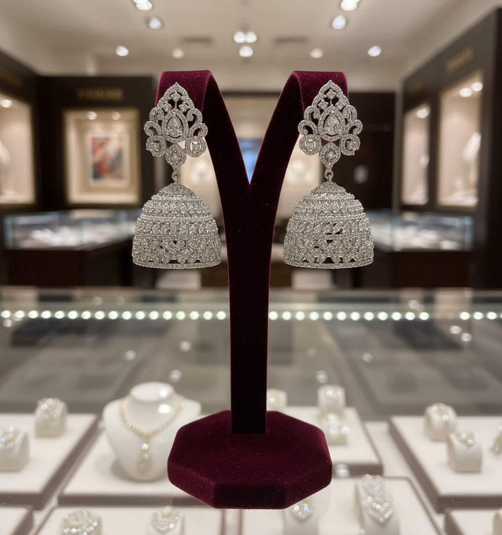 Pair of silver American diamonds jhumka earrings. Party wear earrings.