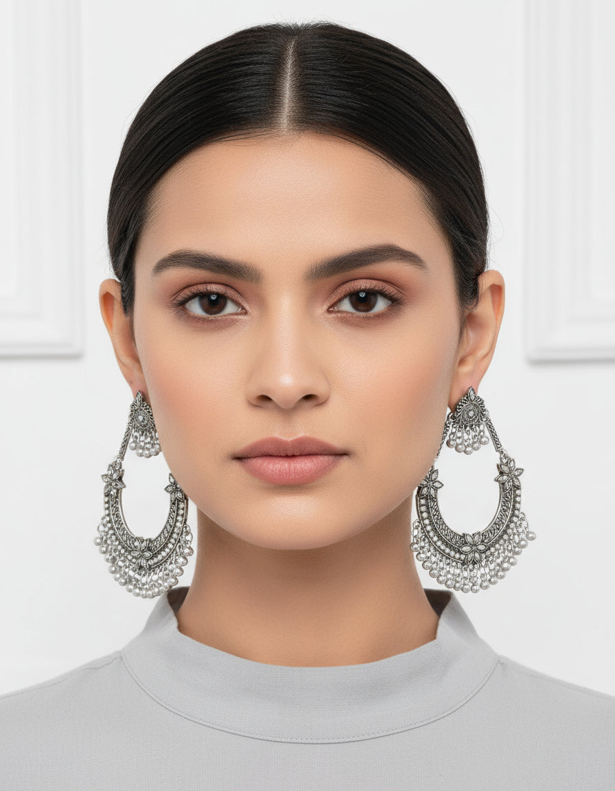 Pair of silver hoop earrings by famaza couture