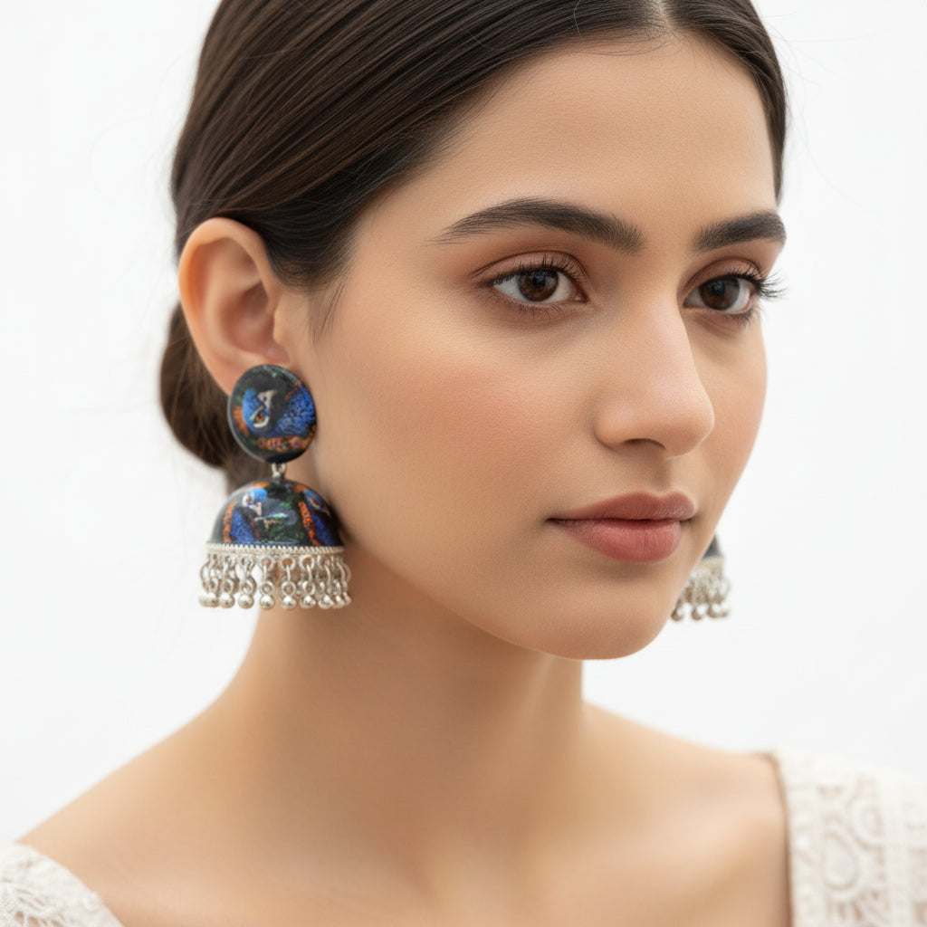 Pair of traditional peacock-inspired statement earrings for festive occasions and ethnic wear.