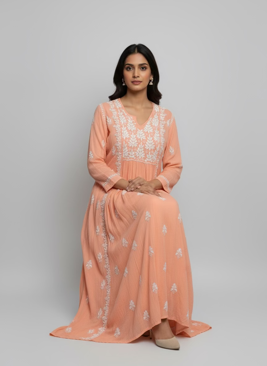 Peach-coloured long dress with high slits on both sides with white floral embroidery