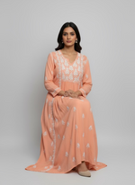 Peach-coloured long dress with high slits on both sides with white floral embroidery