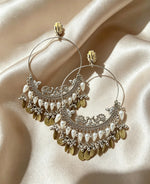 Matching pair of Peacock Chandbali Earrings, antique silver & antique gold finish, white pearlescent teardrop beads, hanging coin charms, push-back closure — displayed on soft cream satin — drop length 13 cm, widest width 7 cm — traditional Pakistani Indian bridal festive ethnic jewelry.