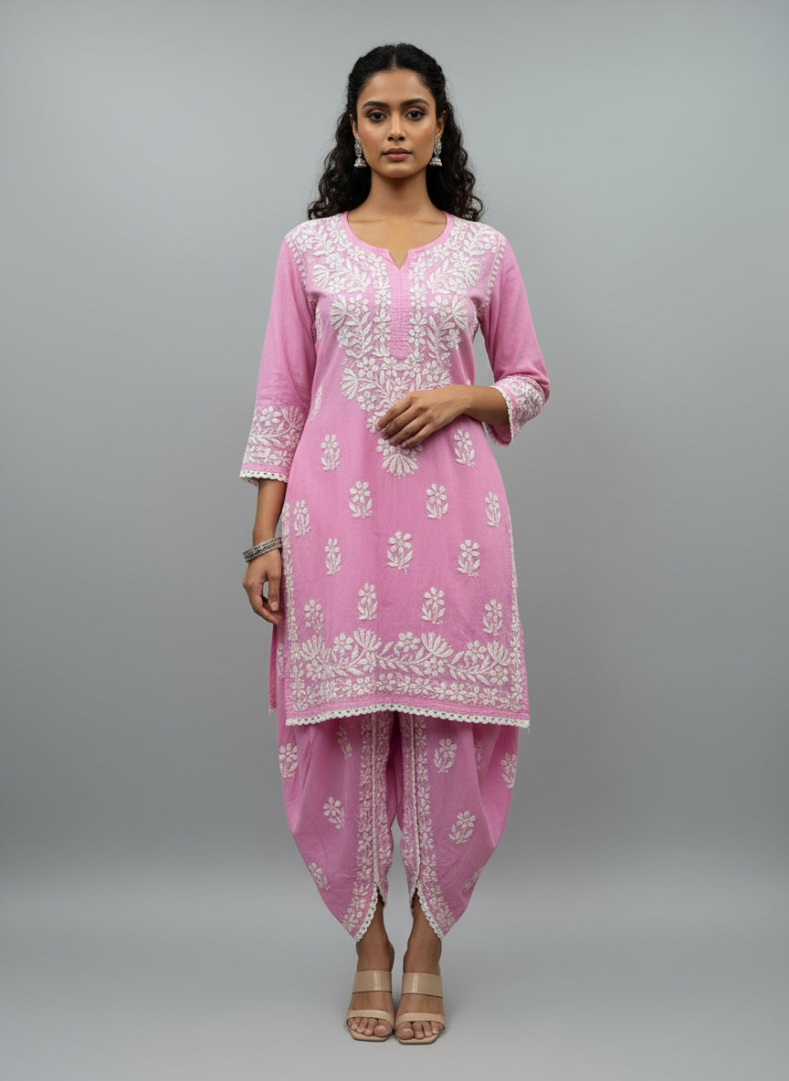 Pink colour cotton fabric kurti and dhoti trousers back side design is showing in this image.