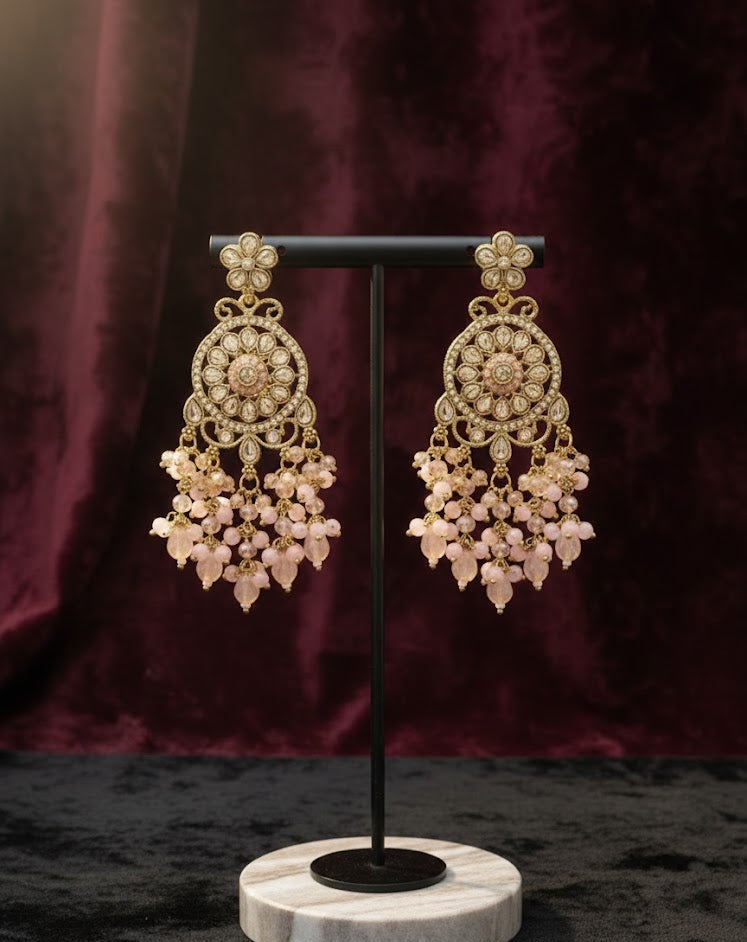 Premium rose gold polish earrings with AD stones displayed on a professional jewellery stand, a sophisticated alternative to golden earrings or pearl sets.