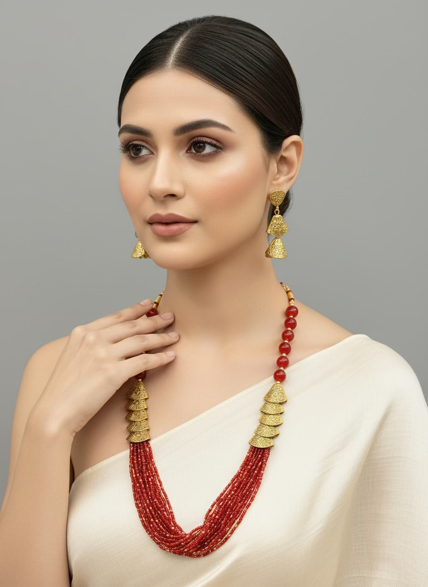 Red beaded mala with gold accents and matching earrings by famaza couture