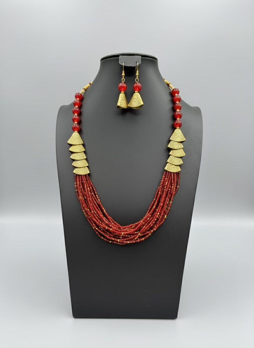 Red beaded necklace with gold accents and matching earrings by famaza couture