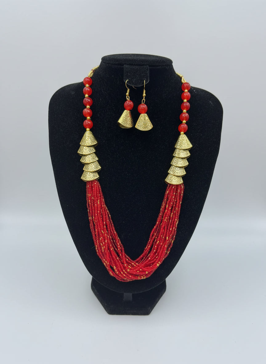 Red braided mala with gold accents and matching earrings by famaza couture. Party wear jewellery set