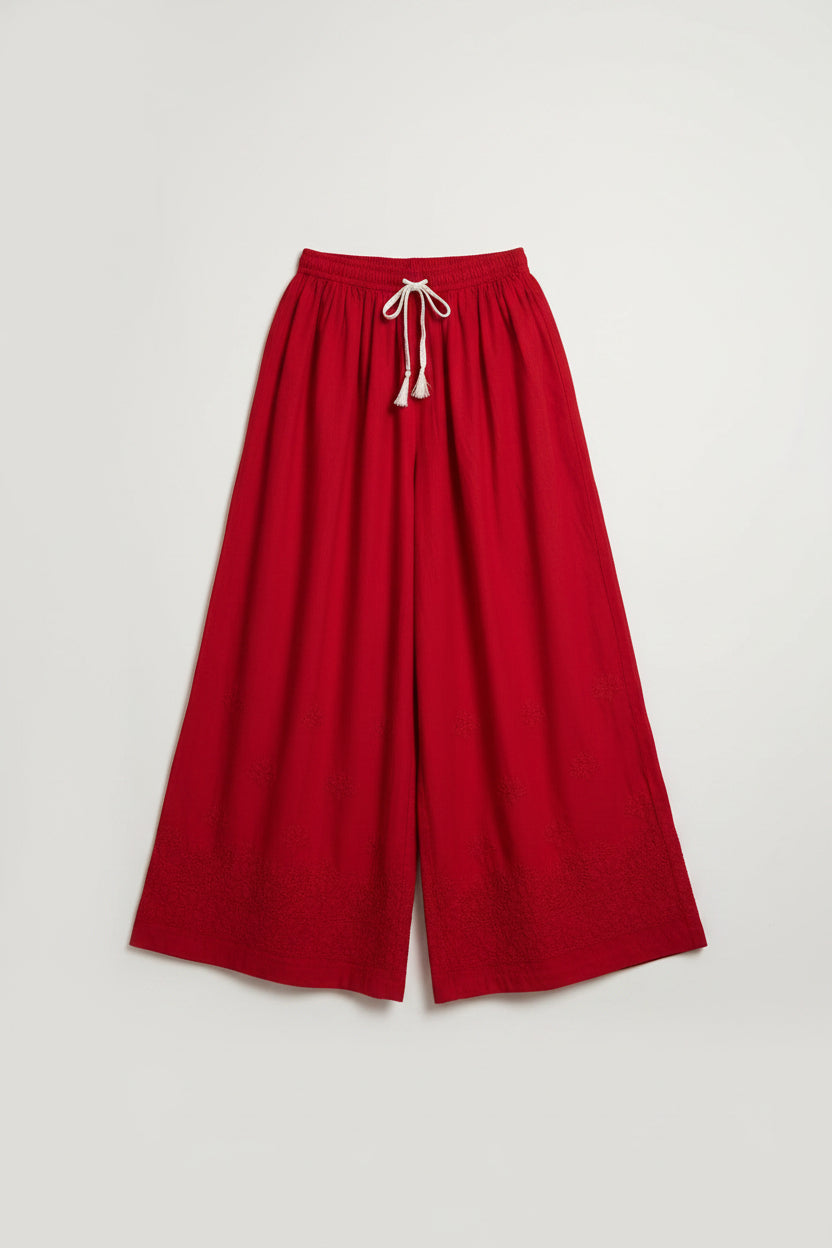 Red cotton wide lag plazo trousers with Tonal red thread Bakhiya hand embroidery is displayed.