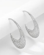 Rhodium plated statement earrings encrusted with White American Diamond (AD) stones featuring a 6cm floral lattice crescent design.