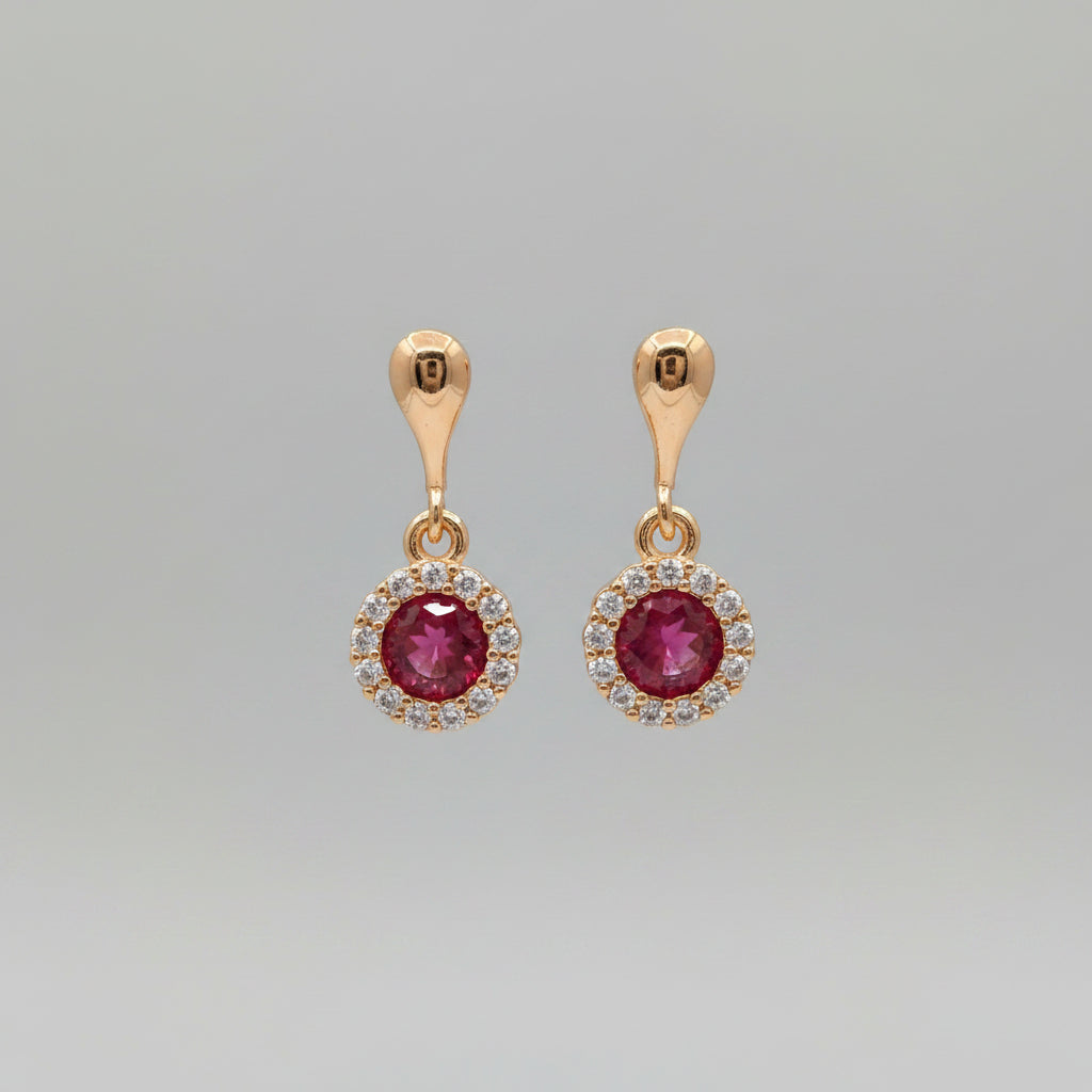 Rose Gold earrings with red gemstones on a CZ Jewellery.