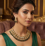 Rose gold bridal choker necklace and earring set with bottle green nano hangings for wedding wear.