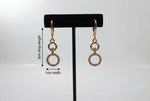 Rose gold polish American Diamond earrings 3cm drop length with 1cm width is shown in the image.