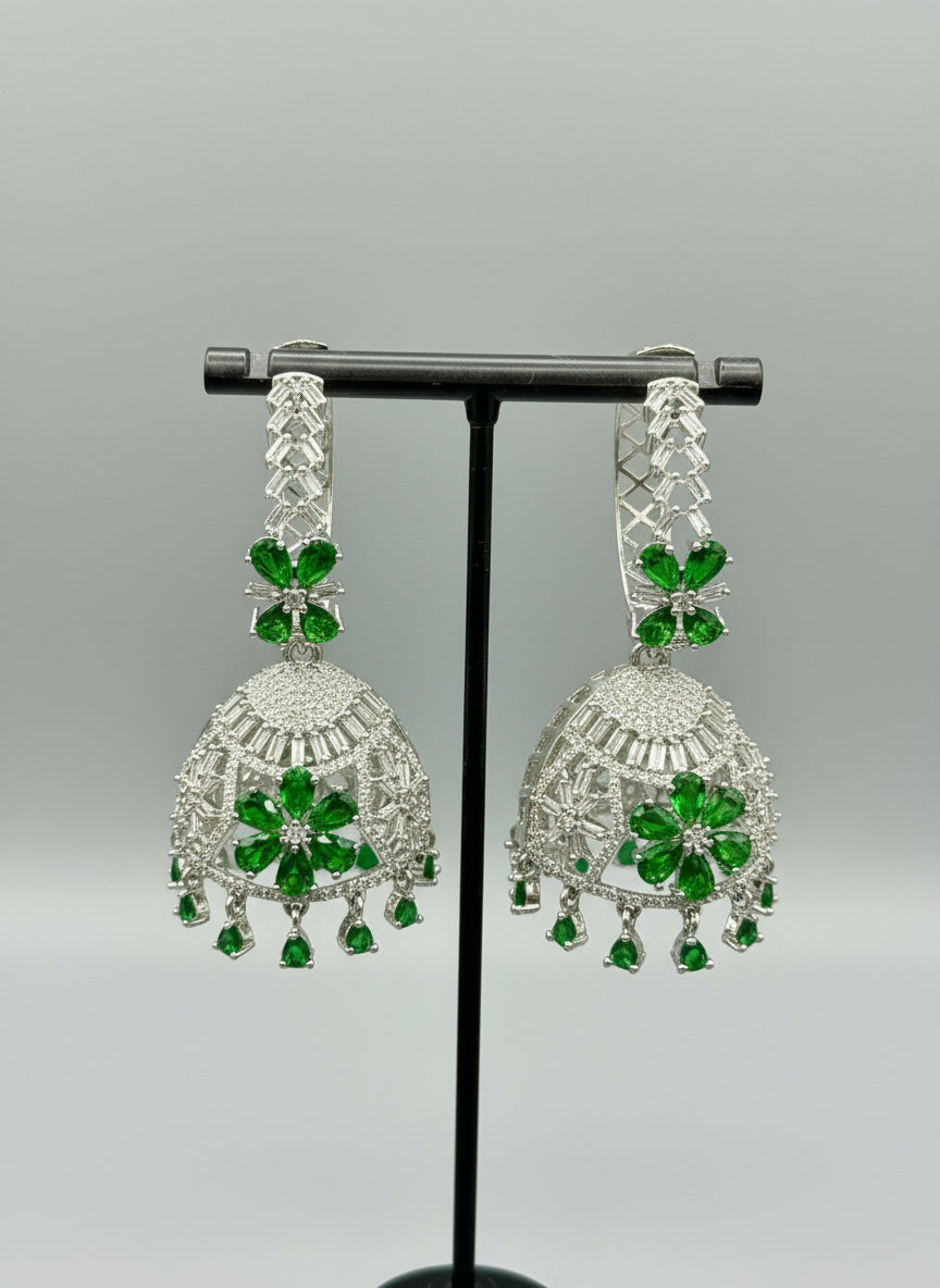 Round bali on top and jhumka in the bottom style earrings with silver AD stones and bottle green stones in flowers.