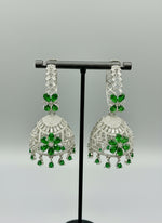 Round bali on top and jhumka in the bottom style earrings with silver AD stones and bottle green stones in flowers.